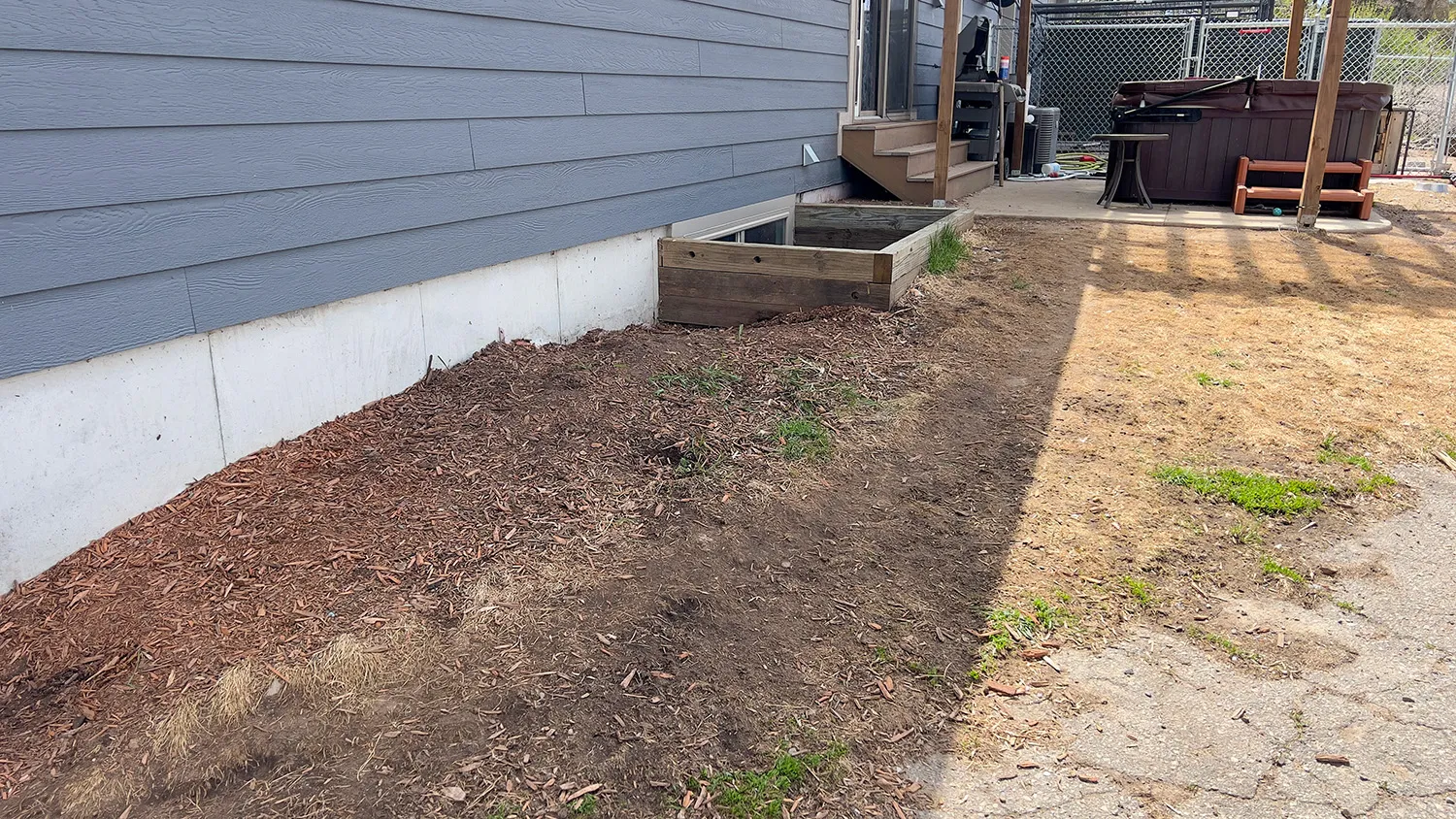 After dog waste cleanup showing the same residential backyard cleared and cleaned